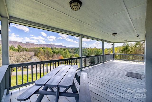 wooden terrace with a mountain view