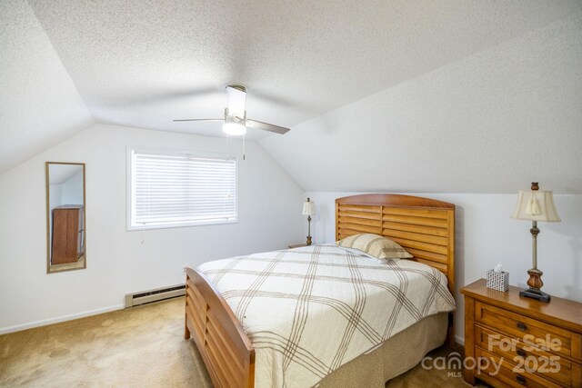 bedroom featuring a baseboard heating unit, lofted ceiling, a ceiling fan, and light colored carpet