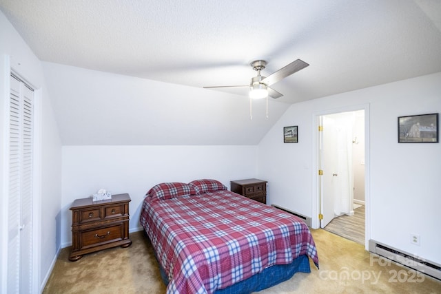 bedroom featuring baseboard heating, a baseboard radiator, carpet, baseboards, and lofted ceiling