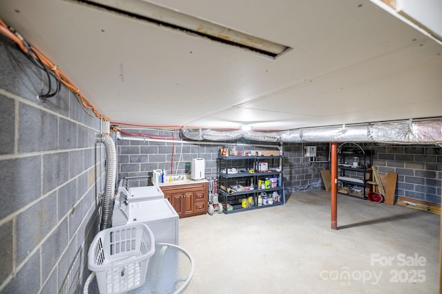 unfinished basement featuring washer / dryer