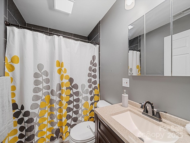 full bathroom with toilet, vanity, and a shower with curtain