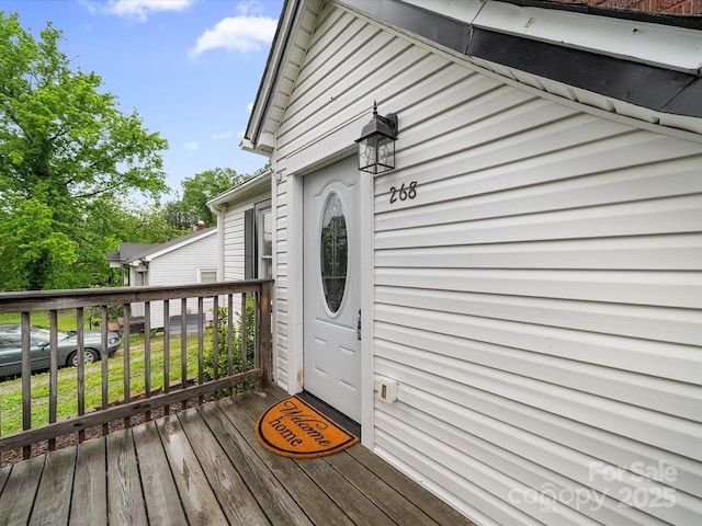 doorway to property featuring a deck