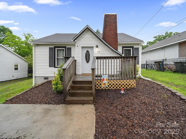 view of front of property with a chimney, a shingled roof, a deck, and crawl space