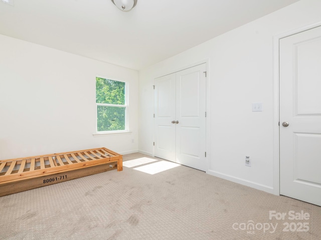 11010 Redcoat Hill Ln, Huntersville, NC 28078 - unfurnished bedroom featuring carpet, baseboards, and a closet