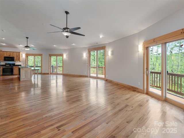 15 Sassy Ln, Asheville, NC 28805 - unfurnished living room featuring baseboards, light wood finished floors, recessed lighting, and ceiling fan