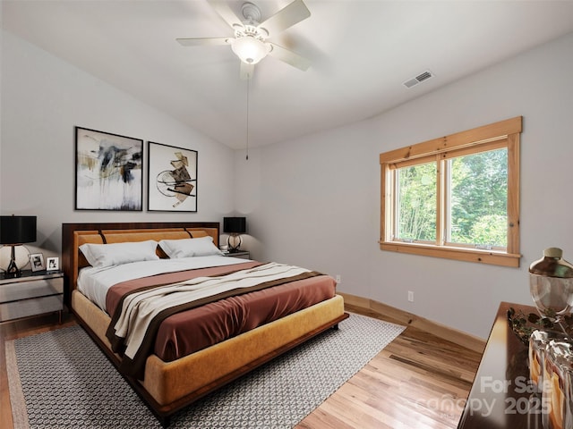 15 Sassy Ln, Asheville, NC 28805 - bedroom with light wood-style floors, baseboards, vaulted ceiling, and ceiling fan
