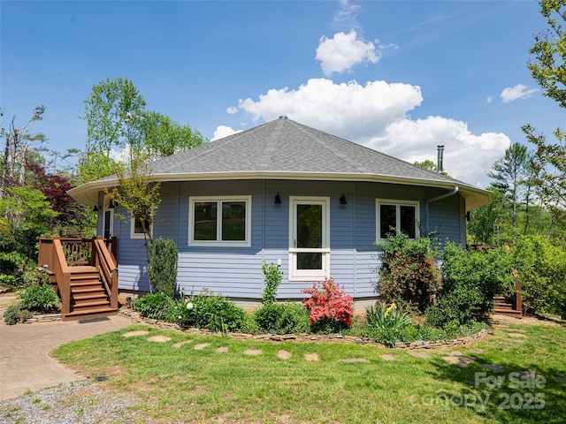 15 Sassy Ln, Asheville, NC 28805 - view of home's exterior featuring a deck, stairs, a shingled roof, and a yard