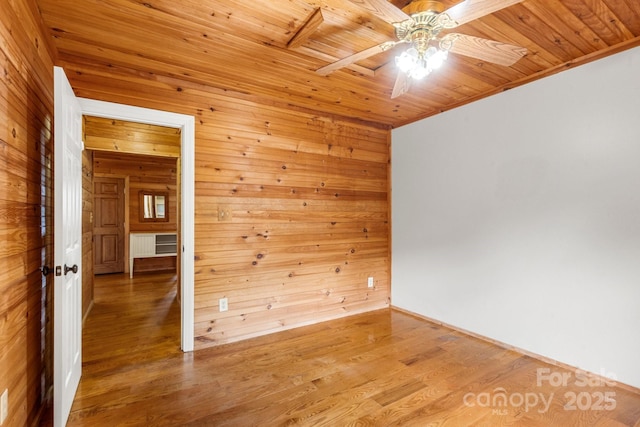 450 Lemmons Rd Unit 4, Mooresboro, NC 28114 - empty room featuring wooden walls, ceiling fan, wooden ceiling, and wood finished floors