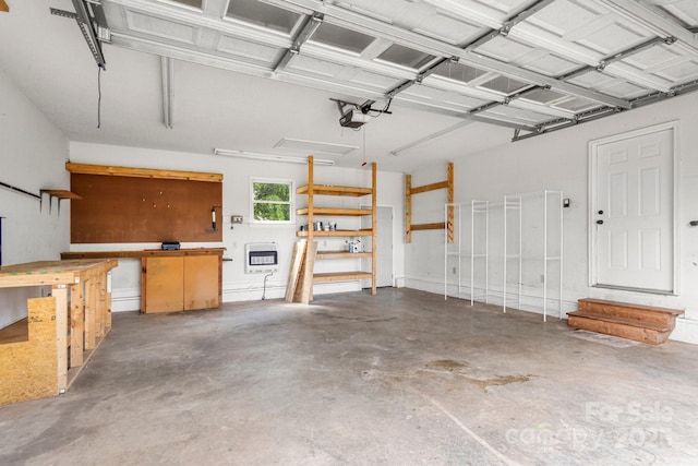 450 Lemmons Rd Unit 4, Mooresboro, NC 28114 - garage with heating unit, a workshop area, and a garage door opener