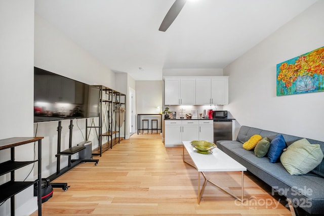 1115 Greenleaf Ave Unit B, Charlotte, NC 28202 - living area with light wood-style floors and a ceiling fan