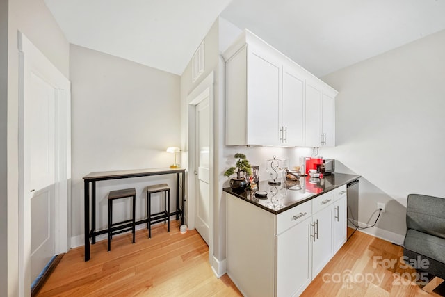 1115 Greenleaf Ave Unit B, Charlotte, NC 28202 - bar with baseboards, stainless steel dishwasher, light wood-style flooring, and visible vents