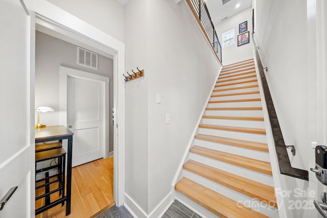1115 Greenleaf Ave Unit B, Charlotte, NC 28202 - stairs featuring baseboards, visible vents, and wood finished floors
