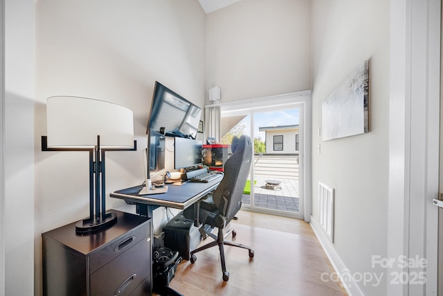1115 Greenleaf Ave Unit B, Charlotte, NC 28202 - office with visible vents, baseboards, wood finished floors, and high vaulted ceiling