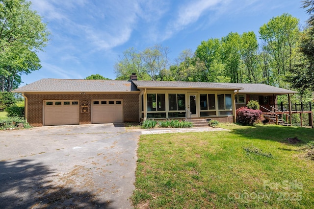 567 Willie Ln, York, SC 29745 - ranch-style home with an attached garage, a front lawn, brick siding, and a chimney