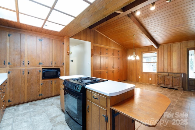 567 Willie Ln, York, SC 29745 - kitchen with brown cabinetry, wooden ceiling, light countertops, and black appliances