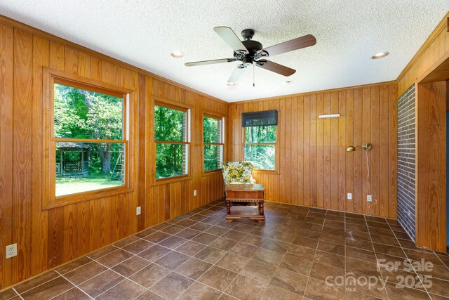 567 Willie Ln, York, SC 29745 - unfurnished room with a ceiling fan, a textured ceiling, and wooden walls