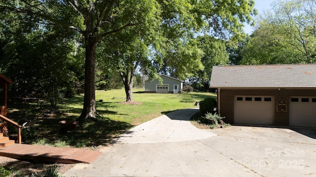 567 Willie Ln, York, SC 29745 - view of home's exterior featuring brick siding, a yard, and a shingled roof