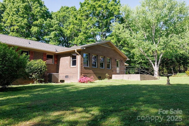 567 Willie Ln, York, SC 29745 - view of side of home with brick siding, central air condition unit, a lawn, and crawl space