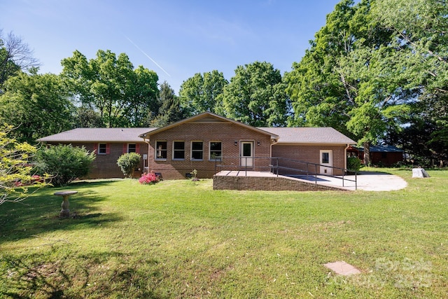 567 Willie Ln, York, SC 29745 - back of house featuring brick siding, a yard, and a patio