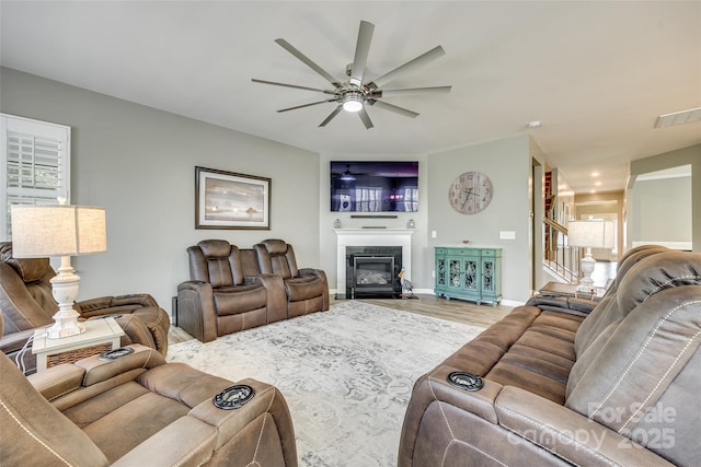 4083 Home Grown Way, Clover, SC 29710 - living room featuring a fireplace with flush hearth, baseboards, visible vents, a ceiling fan, and wood finished floors