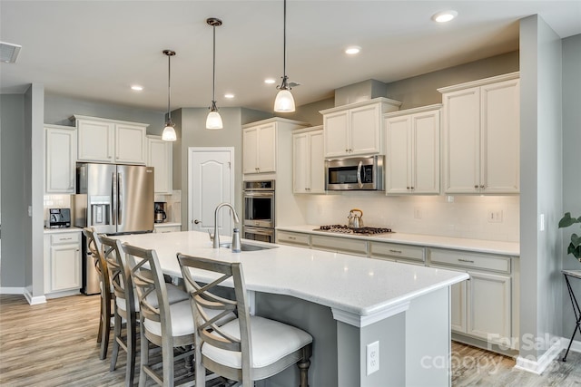 4083 Home Grown Way, Clover, SC 29710 - kitchen featuring backsplash, light wood-style flooring, stainless steel appliances, and a sink