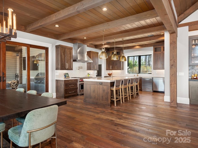 61 Back Bone Way Unit 203, Sylva, NC 28779 - kitchen with wall chimney exhaust hood, dark wood-type flooring, light countertops, appliances with stainless steel finishes, and decorative backsplash
