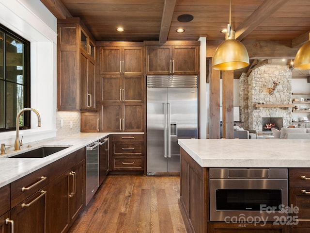 61 Back Bone Way Unit 203, Sylva, NC 28779 - kitchen featuring dark wood finished floors, wooden ceiling, appliances with stainless steel finishes, and a sink