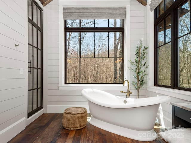 61 Back Bone Way Unit 203, Sylva, NC 28779 - full bath with baseboards, wood walls, a freestanding tub, and wood finished floors