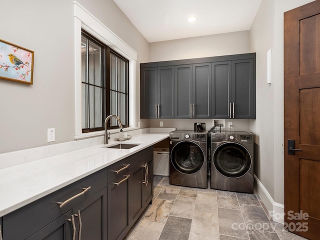 61 Back Bone Way Unit 203, Sylva, NC 28779 - clothes washing area featuring baseboards, stone finish flooring, a sink, washer and clothes dryer, and cabinet space