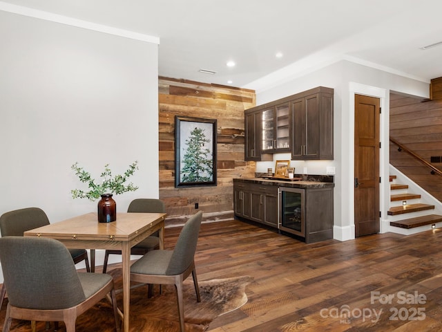 61 Back Bone Way Unit 203, Sylva, NC 28779 - bar featuring beverage cooler, dark wood-style flooring, stairs, wooden walls, and indoor bar