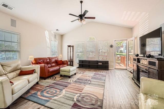3939 Archer Notch Ln, Huntersville, NC 28078 - living area featuring healthy amount of natural light, wood finished floors, ceiling fan, and vaulted ceiling
