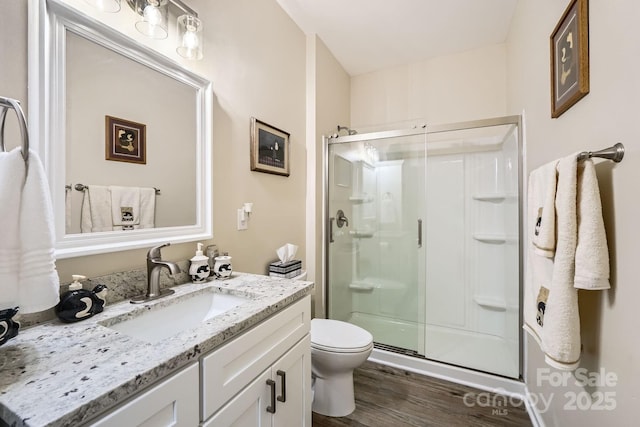 3939 Archer Notch Ln, Huntersville, NC 28078 - bathroom with a stall shower, vanity, wood finished floors, and toilet