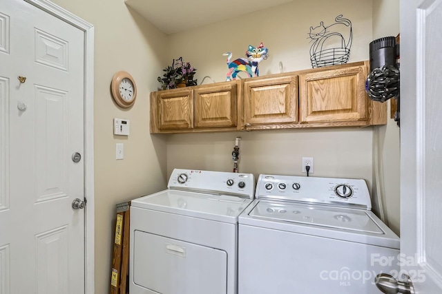 3939 Archer Notch Ln, Huntersville, NC 28078 - laundry room featuring separate washer and dryer and cabinet space