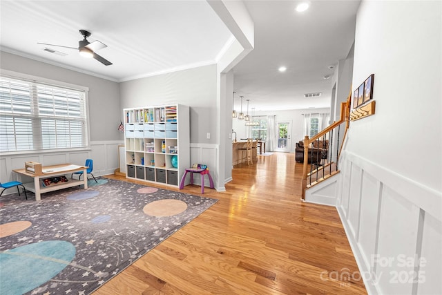 2333 Talon Point Cir, Fort Mill, SC 29715 - rec room featuring wood finished floors, a ceiling fan, wainscoting, recessed lighting, and ornamental molding