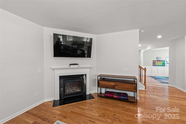 2333 Talon Point Cir, Fort Mill, SC 29715 - living room featuring wood finished floors, baseboards, a fireplace with flush hearth, and recessed lighting