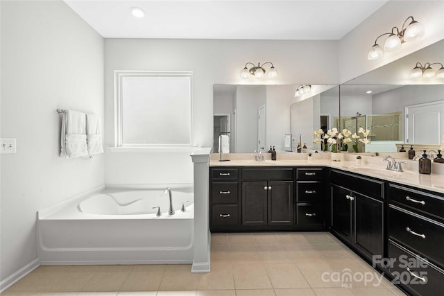 2333 Talon Point Cir, Fort Mill, SC 29715 - bathroom with double vanity, a garden tub, tile patterned floors, a shower stall, and baseboards