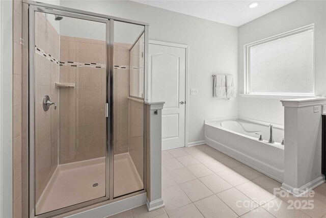 2333 Talon Point Cir, Fort Mill, SC 29715 - bathroom featuring a shower stall, tile patterned flooring, a garden tub, baseboards, and recessed lighting