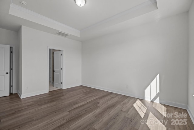 124 Canary Ln Unit 7, Mooresville, NC 28115 - unfurnished bedroom with a raised ceiling, wood finished floors, ornamental molding, and baseboards
