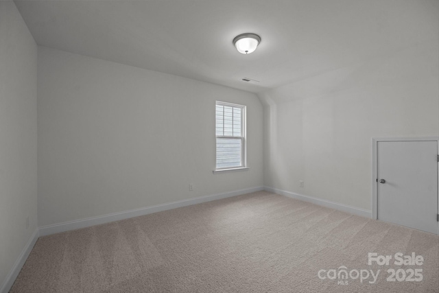 124 Canary Ln Unit 7, Mooresville, NC 28115 - carpeted spare room with baseboards and lofted ceiling