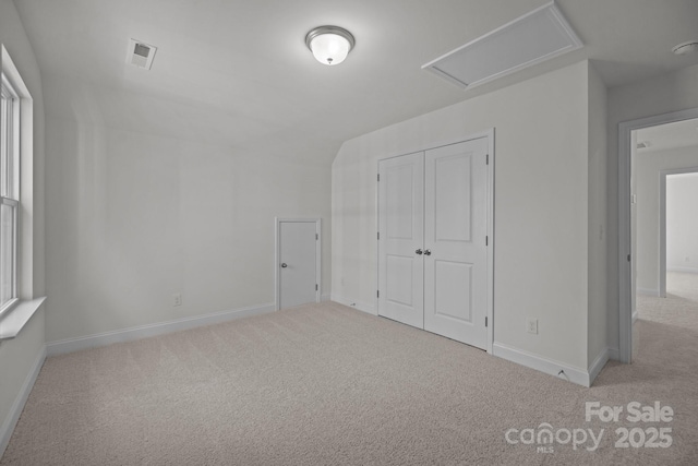 124 Canary Ln Unit 7, Mooresville, NC 28115 - unfurnished bedroom with carpet, attic access, a closet, and baseboards