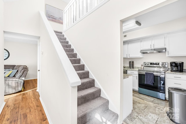 7407 Mystic Ln, Charlotte, NC 28227 - stairway with wood finished floors and baseboards