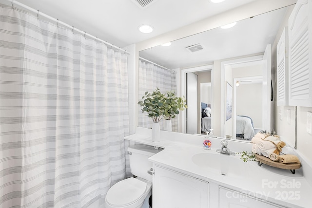 7407 Mystic Ln, Charlotte, NC 28227 - full bathroom featuring recessed lighting, visible vents, toilet, vanity, and connected bathroom