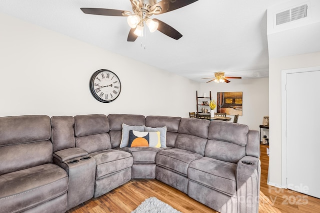 7407 Mystic Ln, Charlotte, NC 28227 - living area featuring a ceiling fan, light wood-style floors, and visible vents