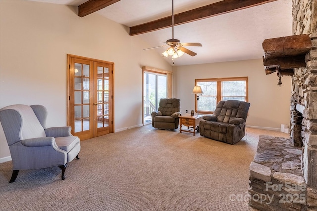 living room featuring carpet flooring, french doors, a ceiling fan, a stone fireplace, and baseboards