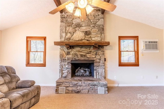 living area with vaulted ceiling, a ceiling fan, carpet flooring, and plenty of natural light
