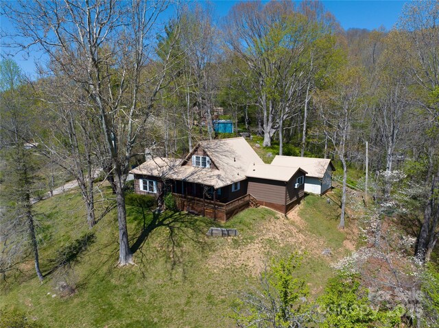 view from above of property with a forest