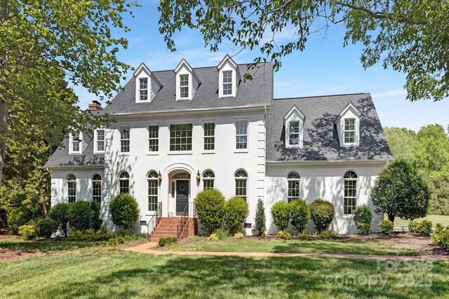 426 Walden Trl, Waxhaw, NC 28173 - colonial inspired home with a shingled roof and a front yard