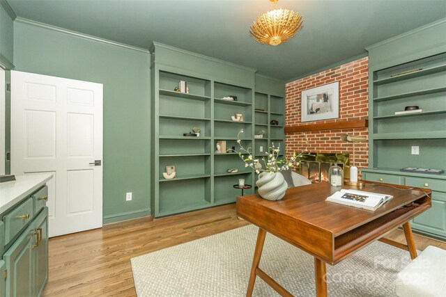426 Walden Trl, Waxhaw, NC 28173 - office space featuring a brick fireplace, ornamental molding, and light wood-style floors