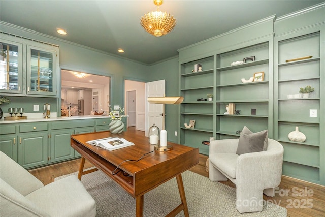 426 Walden Trl, Waxhaw, NC 28173 - office space featuring built in shelves, recessed lighting, dark wood-style floors, and ornamental molding