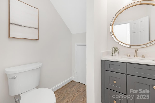 426 Walden Trl, Waxhaw, NC 28173 - half bathroom with baseboards, wood finished floors, toilet, and vanity